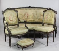 A late 19th century XVI style nine piece salon suite, comprising of a settee, two open armchairs,