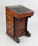 A Victorian mahogany davenport, with pierced three quarter brass gallery, fitted three drawers