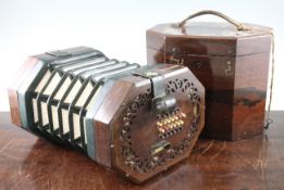 A Victorian C. Wheatstone stretched octagon concertina, with pierced fretwork rosewood ends and