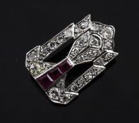 A 1920`s/1930`s Art Deco platinum, ruby and diamond set brooch, of pierced tapering design set with