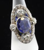 A gold, sapphire and diamond up-finger dress ring, of oval form, set with oval and shaped cut