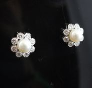 A pair of 18ct white gold, cultured pearl and diamond cluster ear studs.