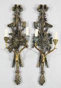A pair of modern carved and painted wall sconces each with twin scrolling branches, 30.5in.