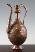 A 17th century safavid copper ewer, with traces of original gilt decoration, the pear shaped body
