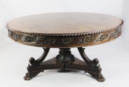 A mid 19th century Anglo Indian carved padouk wood circular breakfast table, with gadrooned border
