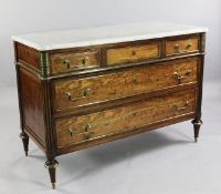 A Directoire brass mounted acajou moucheté commode, with marble top and three long drawers between