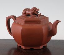 A Chinese Yixing red stoneware hexagonal teapot, 18th century, with lion-dog finial to the