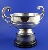 A George V silver two handled presentation pedestal trophy bowl, of circular form, with flying