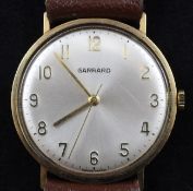 A gentleman`s 1970`s 9ct gold Garrards manual wind wrist watch, with Arabic dial and inscription on