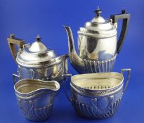 A Victorian silver demi-fluted four-piece tea and coffee set by James Dixon & Sons Ltd, of oval