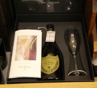 Three bottles of Dom Perignon 1999, two individually boxed each with two discreetly branded glass