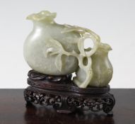 A Chinese celadon green jade `double pomegranate` vase, 17th / 18th century, carved in high relief