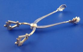 A pair of early 1960`s stylish sterling silver sugar tongs by Georg Jensen, 5.5in.