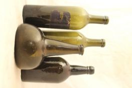 Four wine bottles, 18th - first half 19th century, the first an olive green glass mallet shaped