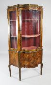 A Louis XV style serpentine gilt mounted and marquetry inlaid vitrine, with single glazed door over