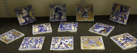 A set of twelve Copeland pottery tiles depicting medieval musicians and musical trophies, late 19th