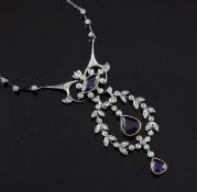 A platinum and yellow gold, sapphire and diamond openwork drop pendant necklace, (a.f.) set with
