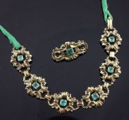 A 1930/1940`s continental 14ct gold and emerald set bracelet and matching brooch, with openwork