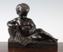 A Victorian patinated bronze model of a reclining putto, on textured rectangular plinth base,