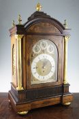 A late Regency brass inset rosewood chiming bracket clock, the arched brass dial with silvered