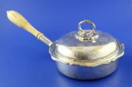A Victorian silver chafing dish and cover, of shaped circular form, with reeded ribbon border and