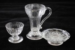 Two jelly glasses and a patch stand, 18th century, the first jelly cup with a panelled bowl on a