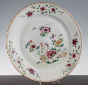 A Chinese export famille rose dish, Qianlong period, painted to the centre with a bird amid