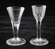 Two wine glasses, c.1740, the first with a drawn trumpet bowl above a teared stem and a folded