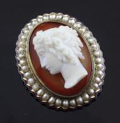 A Victorian gold, enamel, seed pearl and hardstone cameo brooch, of oval form, carved with the head