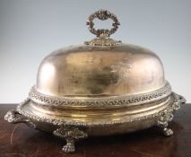 An ornate early 19th century two handled Sheffield Plate meat warming dish and cover, of oval form,