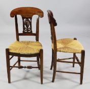 A set of six French neo-classical chairs, with rush seats, the backs with pierced anthemion and