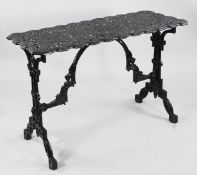 A Victorian Coalbrookdale garden table, with pierced rectangular top, trestle ends, the underside