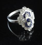 An Art Deco style 18ct white gold, sapphire and diamond cluster ring, size P.