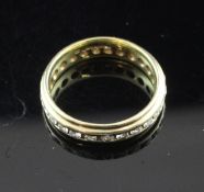 An 18ct gold and diamond full eternity ring, size O.