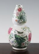A Chinese famille rose double gourd vase, late 18th / early 19th century, painted with birds amid