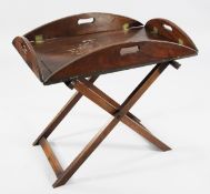 A George III mahogany butler`s tray and stand, the folding sides with brass hinges, W.2ft 4in.