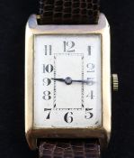 A gentleman`s stylish 1920`s 9ct gold wrist watch in Rolex case, with rectangular Arabic dial,