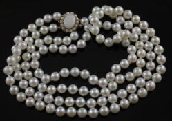A double strand cultured pearl necklace with 9ct gold oval white opal and cultured pearl set clasp,