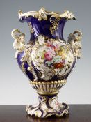 A large English porcelain Rococo revival two handled vase, probably Coalport c.1830, painted with
