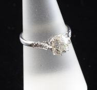 A 1920`s 18ct gold and platinum single stone diamond ring, with diamond set shoulders, the central