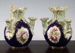 A pair of English porcelain multiple tulip vases, probably Coalport c.1835, each painted to three