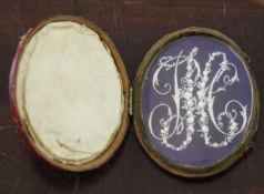 A George III miniature or marriage souvenir, depicting carved ivory initials with flowers, leaves