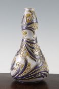 A Doulton Lambeth stoneware double gourd vase, by Mark V. Marshall, c.1905, incised with scrolling