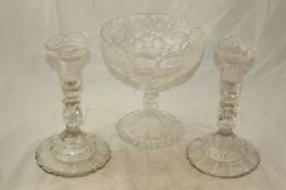 A pair of facetted glass candlesticks, c.1790 and a Regency pedestal bowl, the pair of facetted