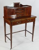 An Edwardian mahogany and satinwood crossbanded bonheur du jour, fitted with two cupboards, drawers
