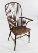 A yew wood, beech and elm Windsor chair, with pierced central splats, on baluster turned legs and H