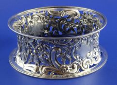 A George V pierced silver dish ring, with engraved initial and embossed with birds amongst
