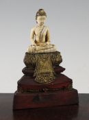 A Thai ivory seated figure of Buddha Sakyamuni, 18th century, seated cross legged, 9cm., set on a