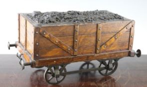 A Victorian novelty oak cigar box, modelled as a coal tender, 13.25in.