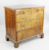 An 18th century walnut chest, of two short and three long graduated drawers with ovolo moulding, on
